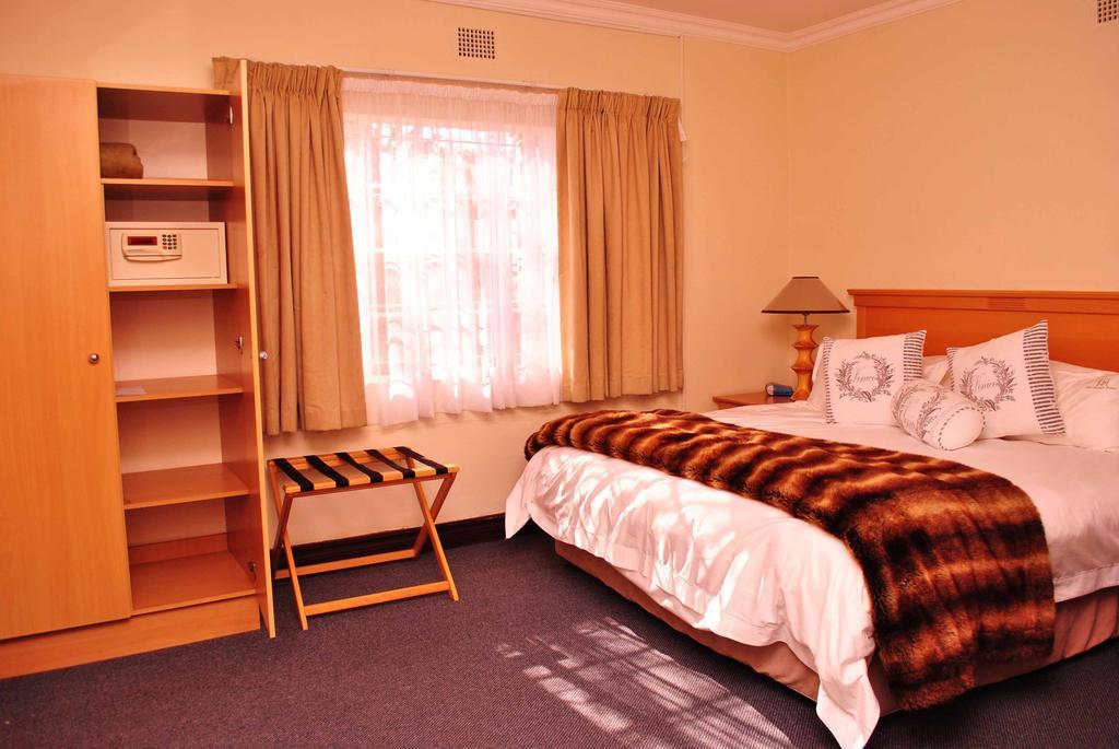 The George Hotel Manzini Pokoj fotografie